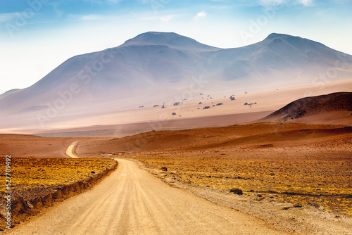 Fototapete Dirt road in Atacama desert, volcanic arid landscape in Chile, South America