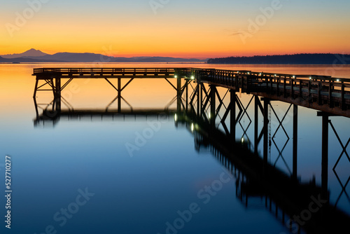 Sidney BC Fishing Pier Twilight Dawn. Summer dawn twilight behind the wooden fishing pier in Sidney British Columbia, Canada.   © maxdigi