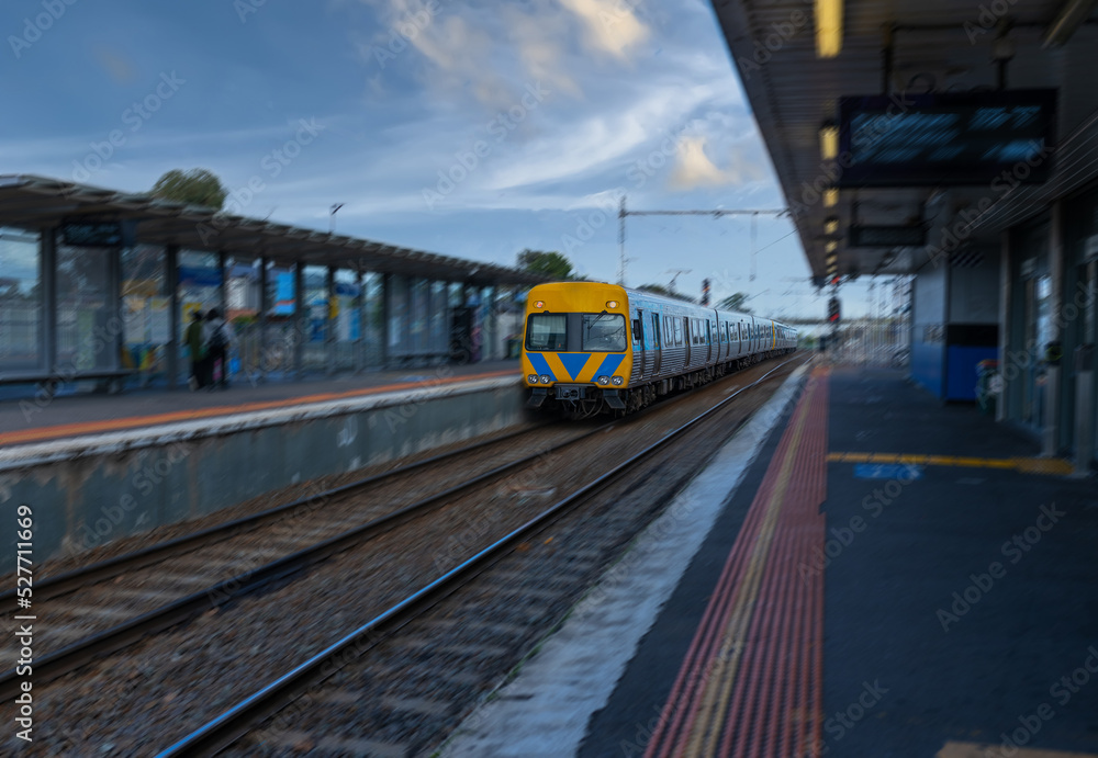 Commuter train approaching a train station in Melbourne Victoria Australia Commuter train approaching a train station in Melbourne Victoria Australia