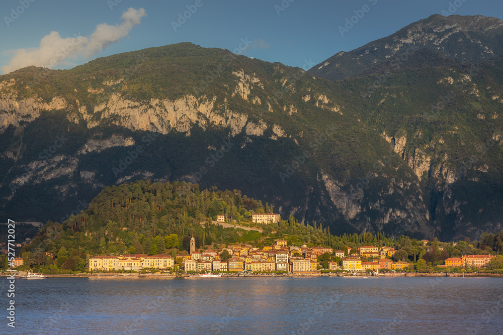 Mountain and Bellagio skyline view from Lake Como at sunset, northern Italy