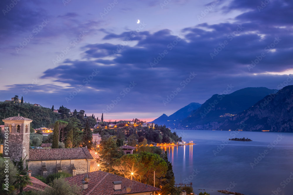Above idyllic Lake Garda in Malcesine at dawn, Italian alps, long exposure