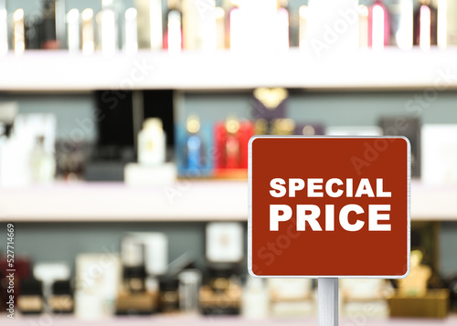 Sign with text Special Price in perfume store