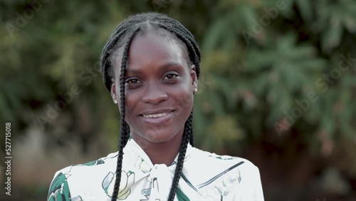 close up of cheerful beautiful African American Lady looking at camera and smiling