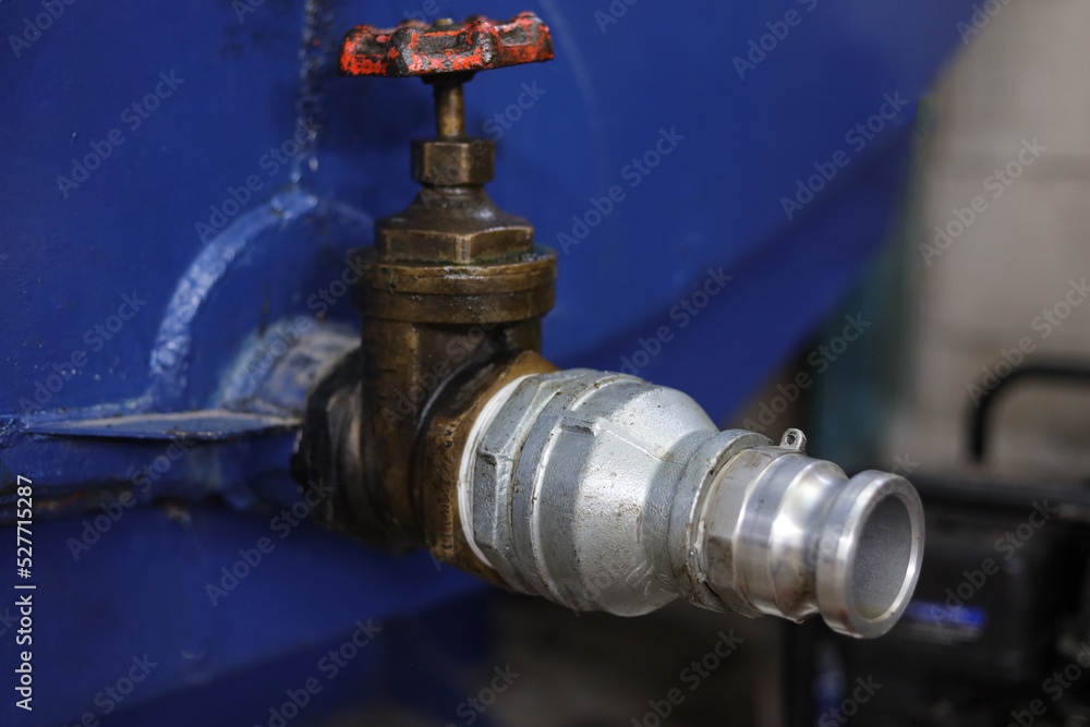 oil drain in a storage tank complete with double nipple, brass valve, shock drat and camlock oil drain in a storage tank complete with double nipple, brass valve, shock drat and camlock
