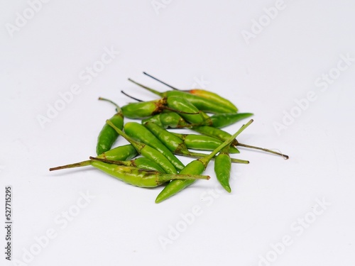 Cabe rawit hijau. Green bird eye Chilli or Green cayenne pepper isolated on white background photo