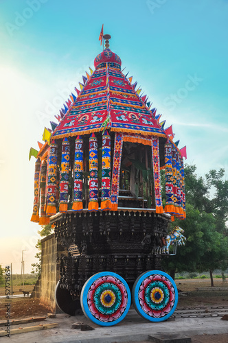 A colorful decorated chariot against the morning sunlight. Sri Kailasanathar Kovil, Nedungudi, Tamil Nadu, India