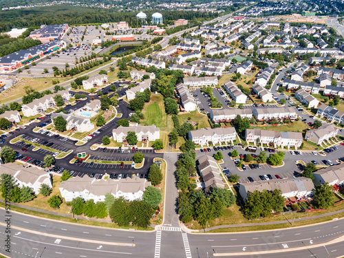 Fototapeta Naklejka Na Ścianę i Meble -  small winding streets, parking lots and roads in a residential area of a small town. Aerial view of