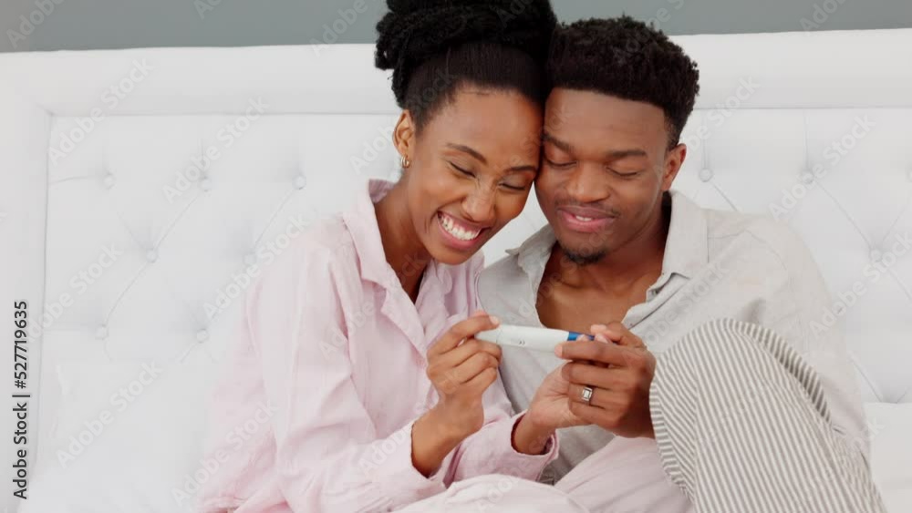Couple, kiss and smile after pregnancy test result and happy in bedroom at home. Black woman and man read a positive baby result, love and happiness to start family together in the house bedroom Couple, kiss and smile after pregnancy test result and happy in bedroom at home. Black woman and man read a positive baby result, love and happiness to start family together in the house bedroom
