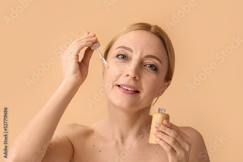 Mature woman with cosmetic ...