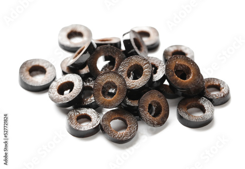 Heap of cut black olives on white background