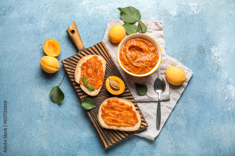 Composition with delicious sandwiches and apricot jam on color background Composition with delicious sandwiches and apricot jam on color background