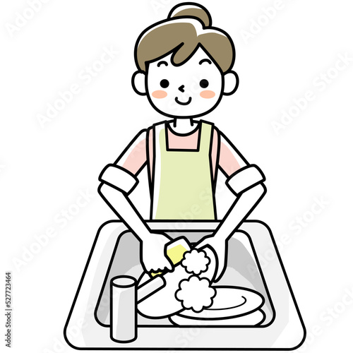 エプロンを着けて食器洗いをする若い女性