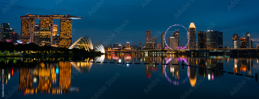 Singapore city skyline with modern skyscraper architecture building for concept of financial business and travel in Asia cityscape urban landmark, marina bay at night district dusk sky