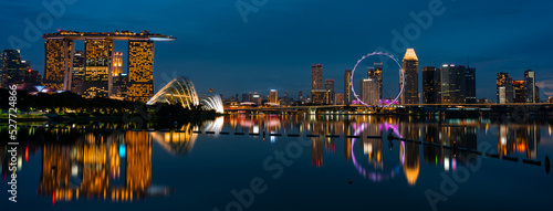 Singapore city skyline with modern skyscraper architecture building for concept of financial business and travel in Asia cityscape urban landmark, marina bay at night district dusk sky