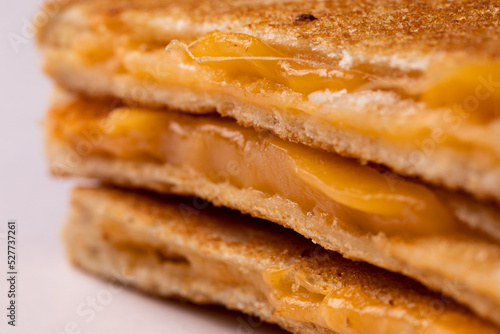 Close-up of fresh melting cheese in toast sandwich