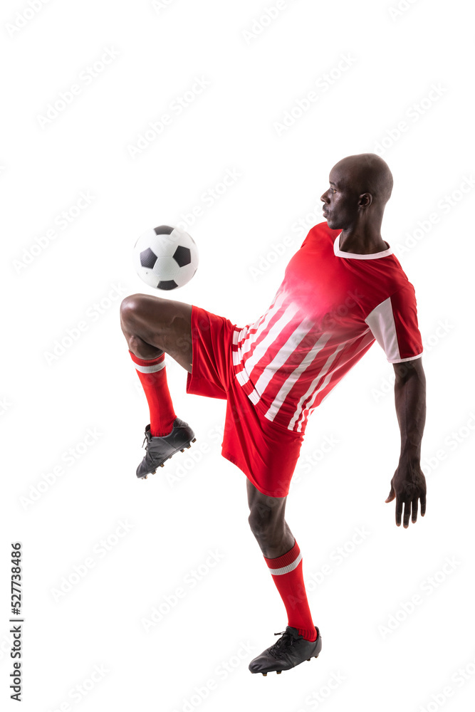 Skilled male african american soccer player kicking ball over white background Skilled male african american soccer player kicking ball over white background
