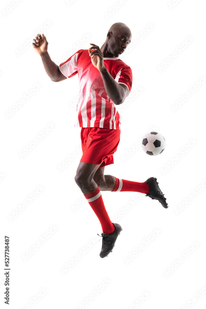 African american young male soccer player controlling ball against white background