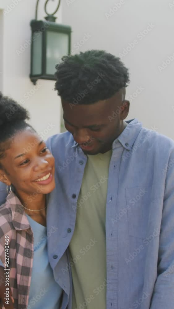 Video of happy african american couple embracing in front of new house Video of happy african american couple embracing in front of new house