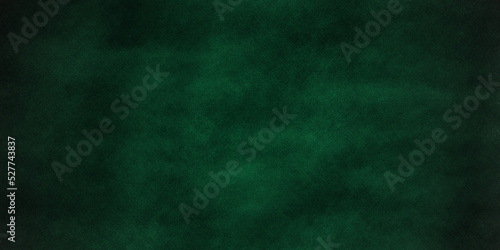 Grunge background with space chalkboard or blackboard green texture. Empty blank with copy space for chalk text. Used feel with chalk traces and great texture. Chalkboard texture. Dark blackboard.