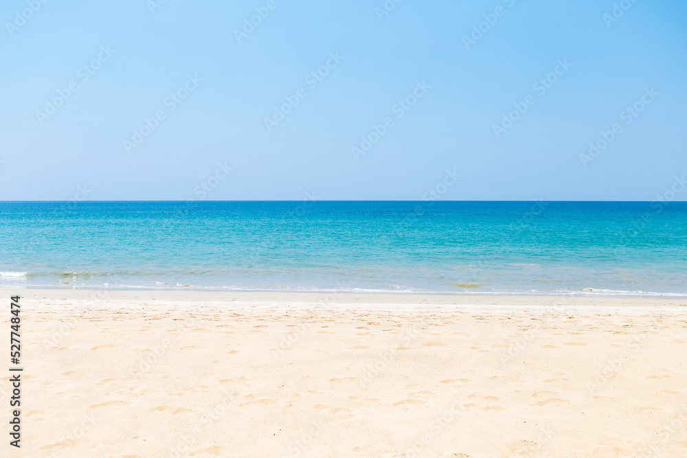 Peaceful tropical beach background, summer holiday destination, clean sandy beach on tropical island in south of Thailand