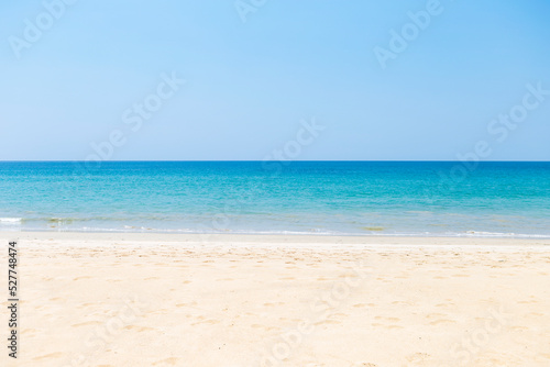 Peaceful tropical beach background, summer holiday destination, clean sandy beach on tropical island in south of Thailand