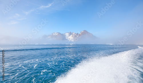 Melting icebergs by the coast of Greenland, on a beautiful summer day - Melting of a iceberg and pouring water into the sea - Greenland © muratart