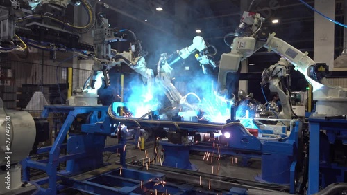 Automatic welding robotic arm, welding car parts with automatic robot, using robots to weld car parts.