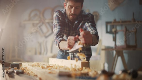 Wallpaper Mural Young Artisan Craftsman in Checkered Shirt Using Hand Plane to Shape a Wood Bar. Handsome Carpenter Working on a Project in a Woodworking Workshop. Torontodigital.ca