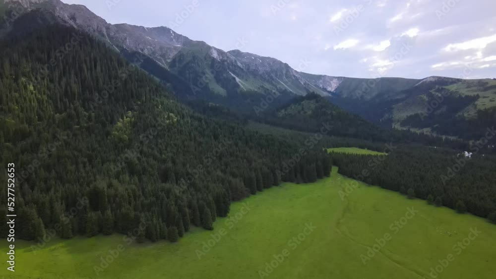 Drone flight among high green mountains Drone flight among high green mountains