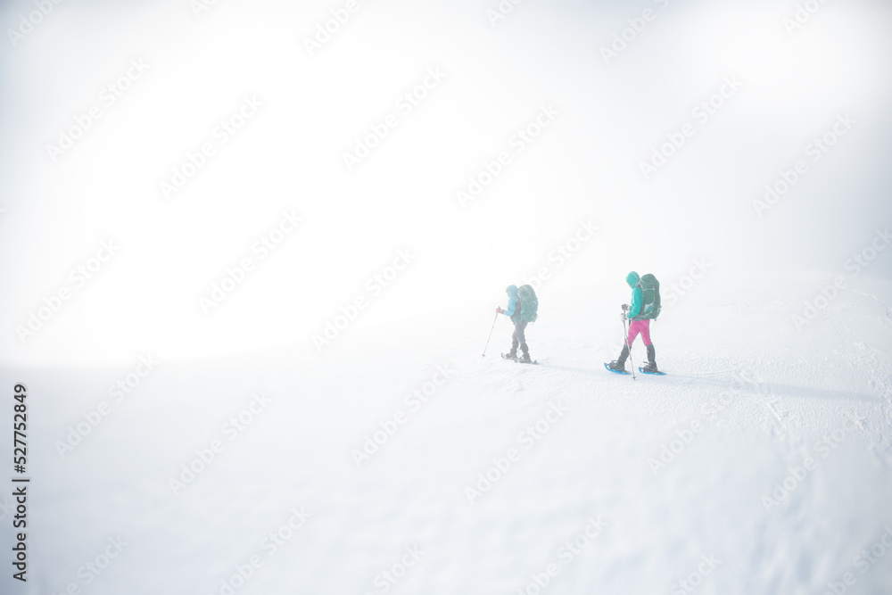 Hiking in snowshoes during a snowstorm
