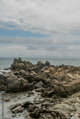Rock formations in ocean cove © aminkorea
