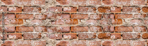 Faktura starego ceglanego muru z naturalnymi ubytkami. old brick wall