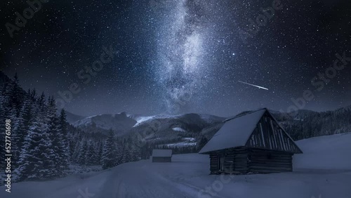 Milky way, cottages and snowy road at night, Tatra Mountains