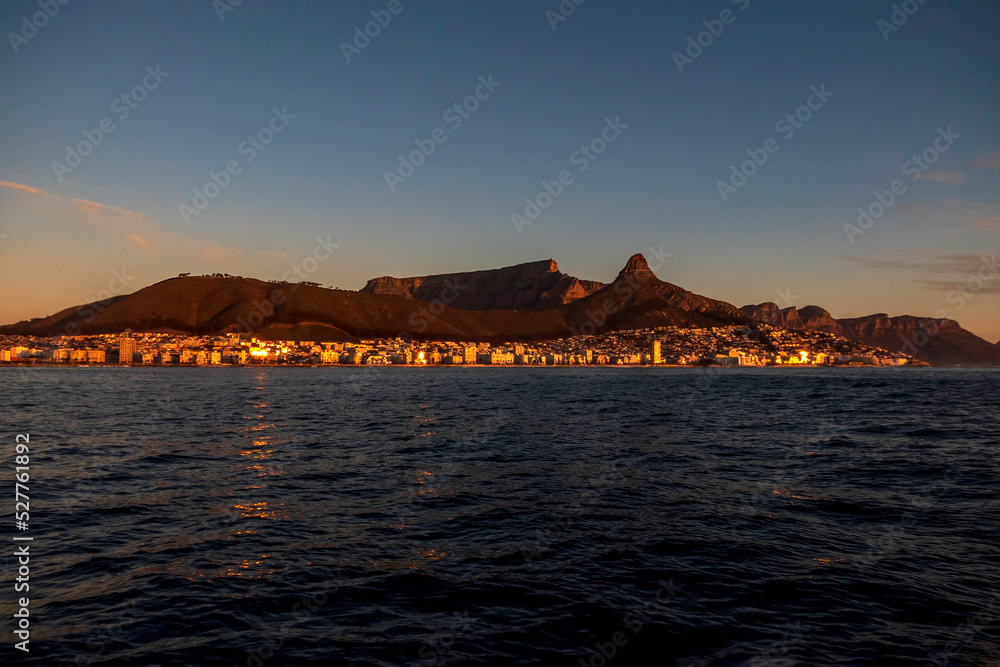 View of the table mountain in Cape Town at sunset from the sea.