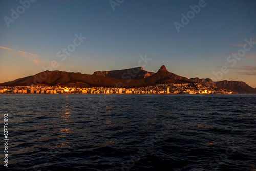 View of the table mountain in Cape Town at sunset from the sea. © Emma