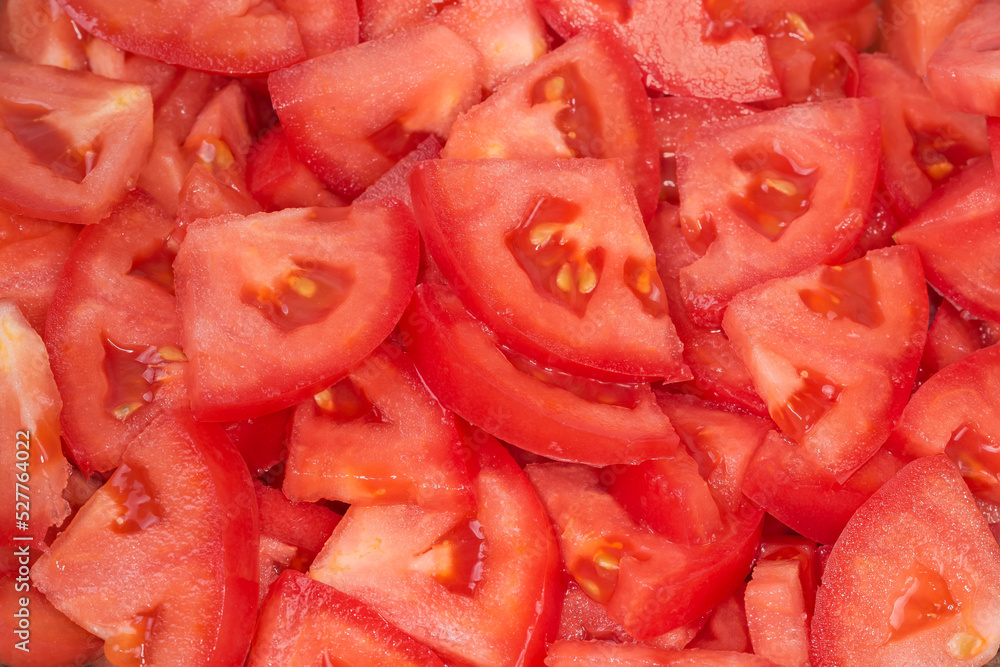 Slices of the red tomatoes, top view close-up