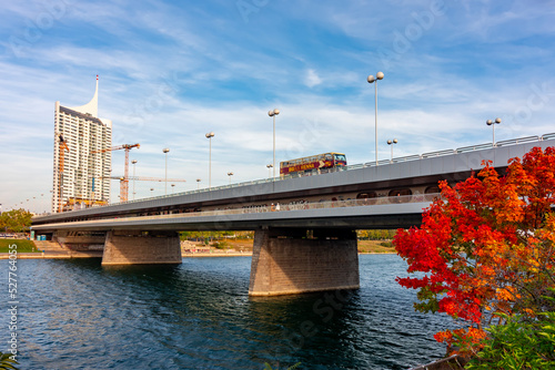 Photography Imperial bridge (Reichsbrucke) over Danube river in autumn, Vienna, Austria