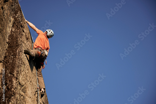 Rock climber reaching top