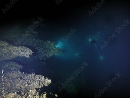 Scuba diving at chandelier cave in Palau. Diving on the reefs of the Palau archipelago.