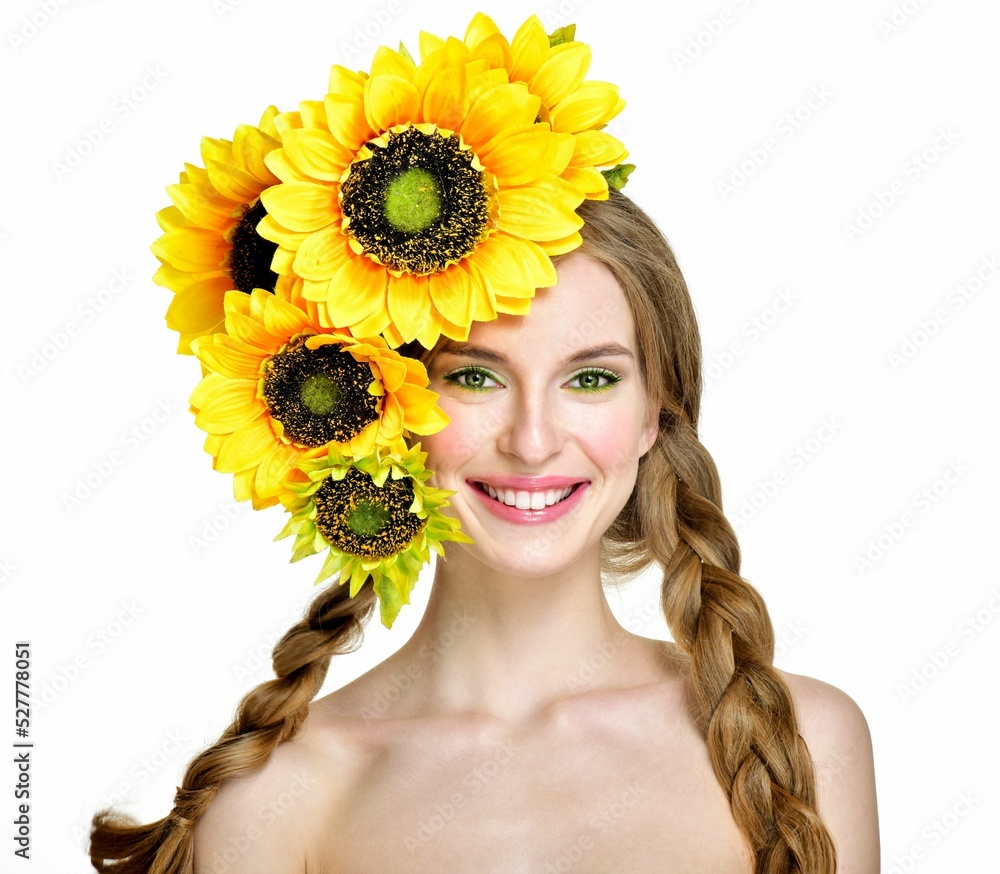 Autumn Woman Fashion Portrait. Beautiful Model Girl with sunflowers in hairstyle. Smiling girl