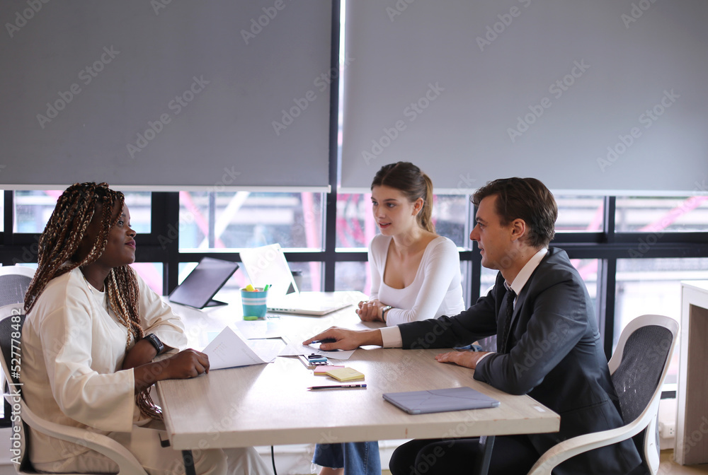 Shot of a group of businesspeople in a meeting at work Shot of a group of businesspeople in a meeting at work