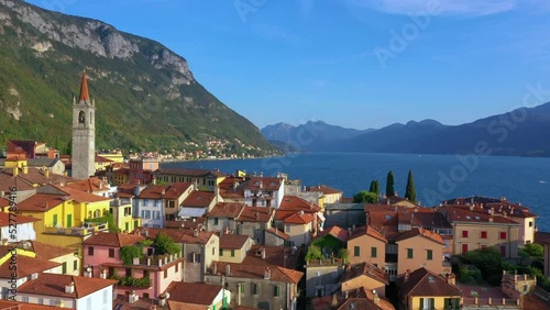 Village of Varenna on Como lake in Italy. Varenna by Lake Como in Italy, aerial view of the old town with the church of San Giorgio in the central square. Famous mountain lake in Italy photo