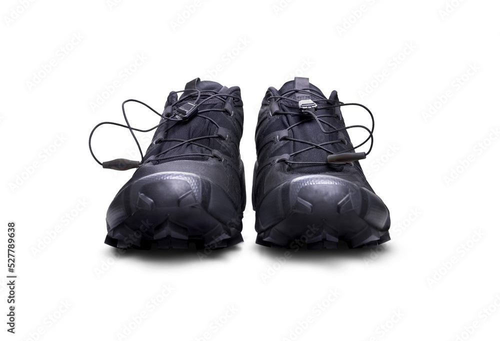 A front view of black trainers, sneakers Isolated on a flat background.