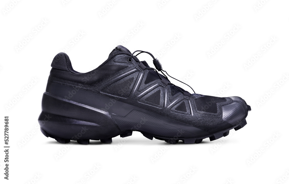 A side view of black trainers, sneakers Isolated on a flat background.