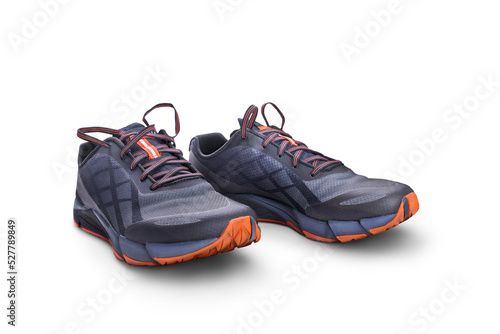Obraz na płótnie A front view of grey and orange trainers, sneakers Isolated on a flat background. w salonie