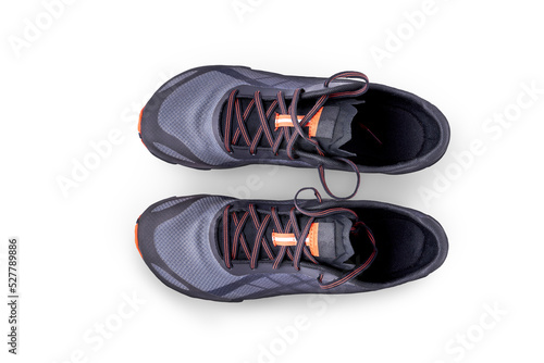Obraz na płótnie A top view of grey and orange trainers, sneakers Isolated on a flat background. w salonie