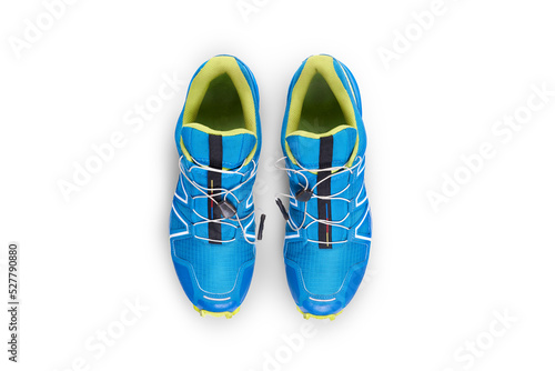 Obraz na płótnie A top view of blue and yellow trainers, sneakers Isolated on a flat background. w salonie