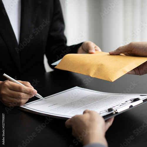 Businessmen give dollars to bribe employees in signing contracts to buy illegal land and real estate, Business fraud and social injustice, corruption and bribery concept.