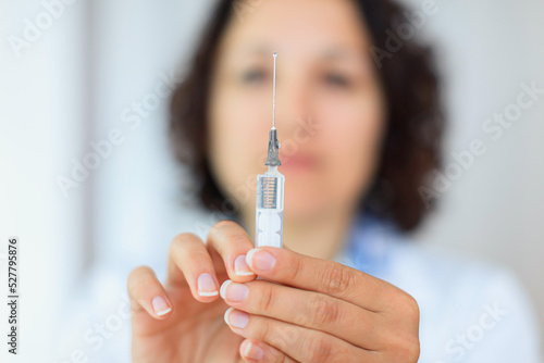 Nurse holding a syringe at the hospital