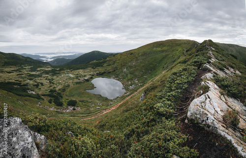 Lake Nesamovite and the surrounding landscape, the black water of the lake in autumn, autumn in the Carpathians, the lake above. photo